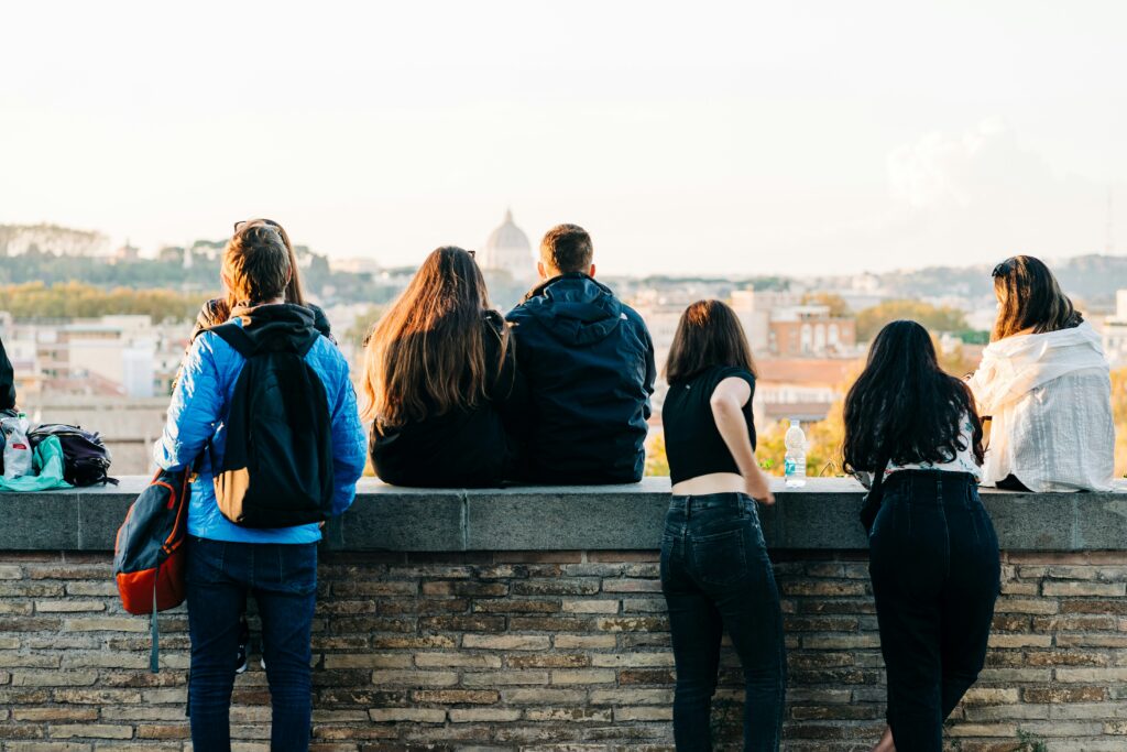 Group of students with backpacks overlooking Rome, Italy
